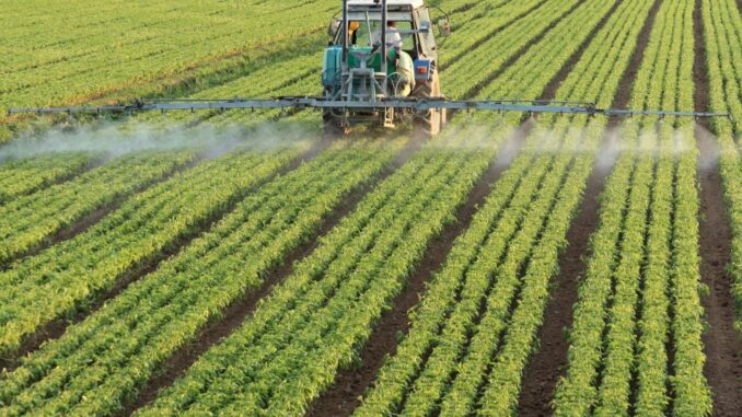 spraying a field